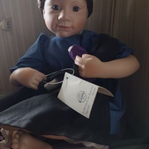 Amish porcelain doll with a baby doll
